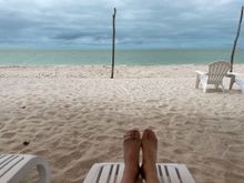 My feet with bandage on broken toe