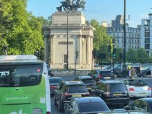 Photo from the bus, so many interesting statues.  Road past Buckingham Palace, no one home.