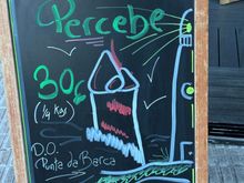 Sign announcing the availability of percebes (goose barnacles) and their price.  These are some of the most expensive treasures of the sea, found in Spain.