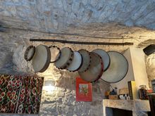 Hanging tambourines played during the pizza dance