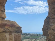 Looking through the old walls down to the coast