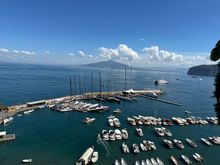 View from terrace with marina, ferries and Vesuvius in the distance