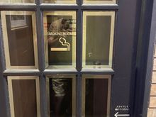 This is a smoking room.  We've seen a number of these. This one was just across from the bathrooms.  Slide the door, step inside, and light 'em if you got 'em.