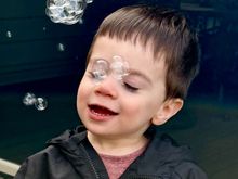The water pistol that makes bubbles is his new favorite toy!
