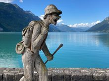 One of the many wooden sculptures along the lakeside in Brienz (look how clear the skies are at that hour)