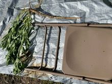 Folding chair is holding down tarp and gives sense of length.
