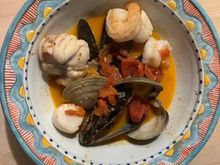 Shrimp, clams, mussels, scallops and monk fish in Thai Red Curry stew