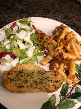 
Ziti bolognese,  salad with homemade ranch (urgently requested by all parties, lol, and garlic Parmesan bread.  I had this loaf that was the tiniest bit stale and gave it the full Monty of melted
Butter, garlic, dried herbs and grated Parmesan.  It’s a recipe from their school days they remember fondly as we had it a lot with spaghetti.