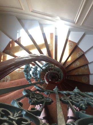 Top of the spiral staircase.  See her feet.