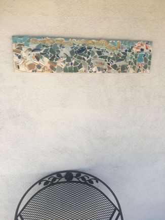 My broken plate mosaic at our front door. 