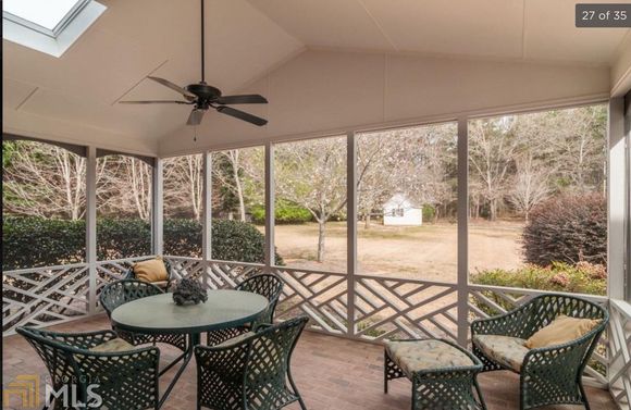 
Excellent screened porch with skylights, just one step down to back yard, so much better for Mr. Fluffy!