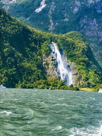 A permanent water fall, Bowen Falls.  Bowen River plunges from atop of a 162-m cliff into the sound.  They take the boat up nice and close and anyone outside gets drenched.