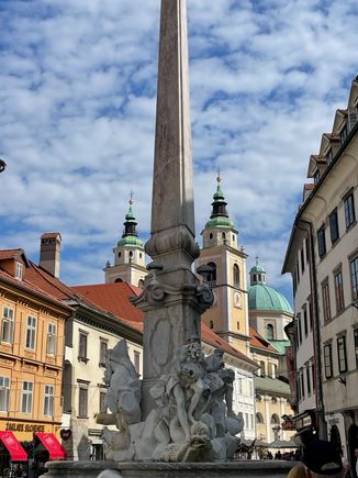  Photo of a square on the back main street in the old town. This statue is in front of the Town Hall. Which dates from the 1400 hundreds.  Meanwhile, I remember when the first Krispy Kreme came to Los Angeles in maybe 2010? Not the same.