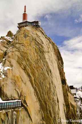 The top most point, the needle.