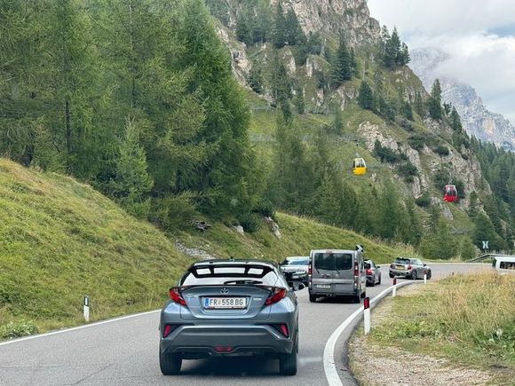Plans/Frara gondolas descending over the road into town from the west