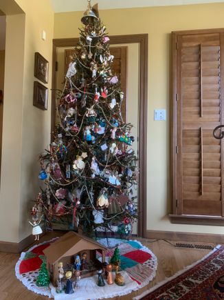 Fodors won’t let me do a vertical of this despite five tries… Anyway, she always does an angel tree and you at least get to see part of it. Can’t believe she remembers where each one of these ornaments came from. 