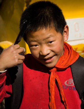 We gave this boy a bunch of new combs and asked him to share them at his school that morn.