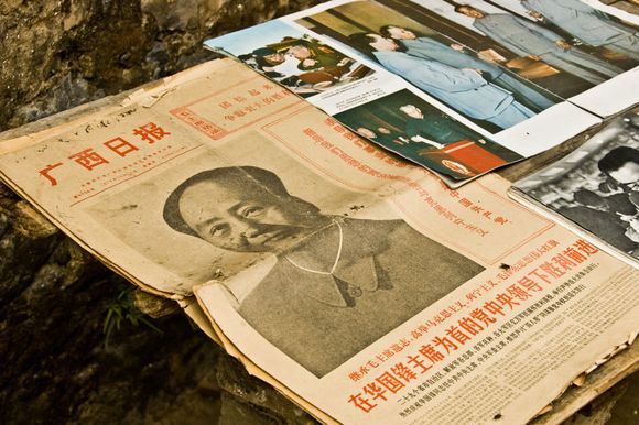 Mao newspaper collectibles in Yucun 'fishing' village. *See our Bill Clinton story about this location in the Li River section, involving Chun Li 'Angel'.