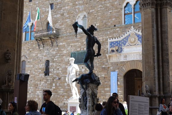 Perseus with the Head of Medusa, and the replica of David in the background