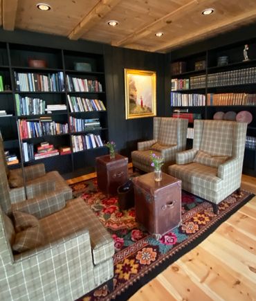 One of many cozy books and crannies in which to relax, read a book or have a drink. 