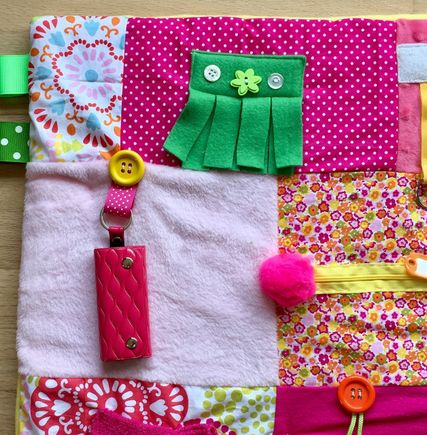 This is a Fidget Blanket, they love  to  twist and turn the items , button and unbutton  also,  it keep their  dexterity  of the hand  exercised.