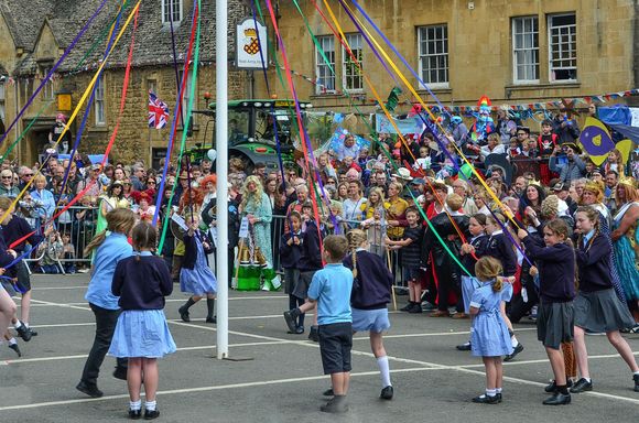 ...students from both of CC's primary schools joined round the Maypole in dance too. 