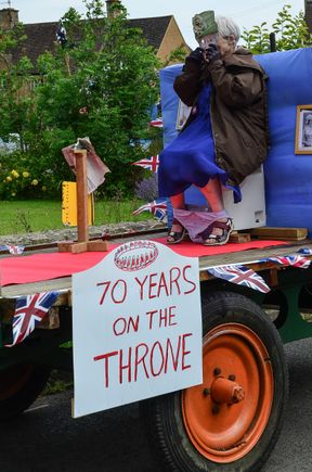 Not all supported celebrations of the Queen's Jubilee. This farmer's wife reminded us of the anti-royal graffiti that we'd seen in London's Brick Lane. Her husbear was not shy about parading their private float around town.