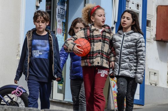 Four raggazzi headed to play calcio. Argentinian superstar Diego marradona is revered here, with tiny shrines to prove it!