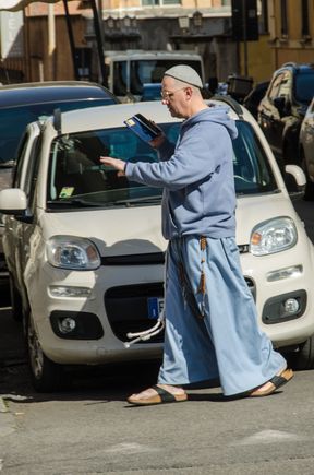 Passerby across from basilica. He is summoning Vatican police to come arrest the evil camera-toting tourist.