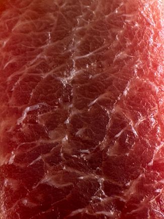 Sashimi of ventresca, belly of tuna. a personal favorite.
But you can see that there are more obvious threads of white fat running through t his piece....compare to the sashimi at EL CAMPERO.  Nothing can touch the latter. 