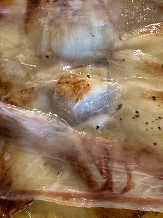 Jamon Iberico sheet over roasted artichoke