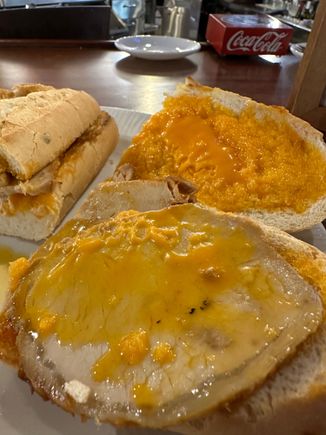 Sandwich opened up to offer inside view...see how lard melts with heat of stove, becoming yellow as opposed to the original orange on the slice at rear......oh, boy, that was great!!!!!