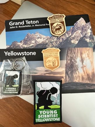 2 junior ranger badges,  young scientist of Yellowstone patch and keychain 