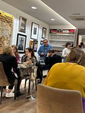 Dining room, then from my rear corner table; note sneakers on the feet of many diners!!