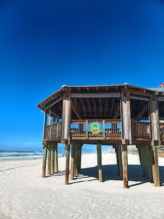 Some restaurants have beach patios for dining that offer a nice beach view, this one is Pineapple Willy's 