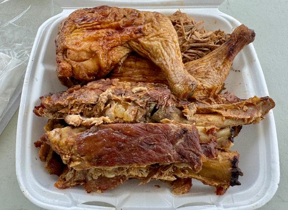All this for 20 bucks, which was more than enough to feed the four of us. The pound of delicious pulled pork is hidden under one of the chicken quarters as are the other six ribs.