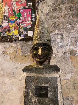 Pulcinella statue - note the light and shiny nose!