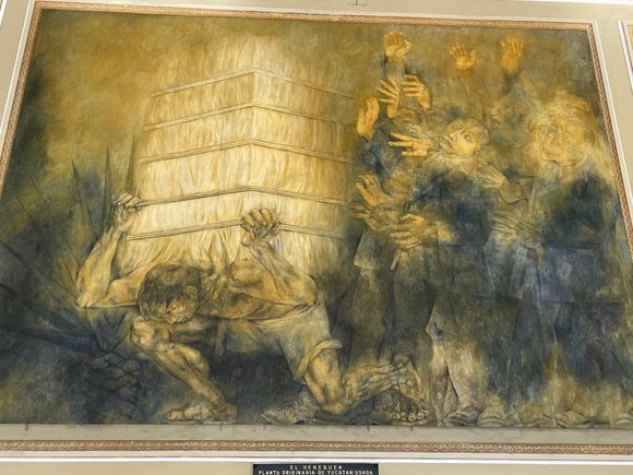 This mural relates to hennequen and how the people were enslaved to harvest and manufacture it and the rich guys stood around.