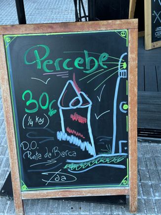 Sign announcing the availability of percebes (goose barnacles) and their price.  These are some of the most expensive treasures of the sea, found in Spain.