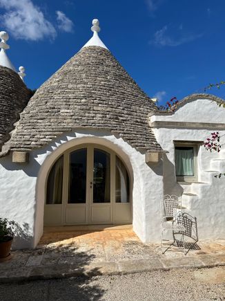 Our Trullo suite at MASSERIA CAMARDA...roomy and very comfy, with mini-kitchen (stovetop; frig; clean pots and pans; plates and cups--you could easily cook a meal here, and there is a dining table and lots of chairs, along with a pull-out sofa