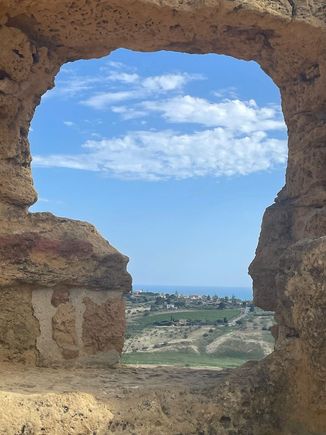 Looking through the old walls down to the coast