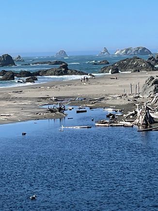 Beach area around the north side of the parking lot.