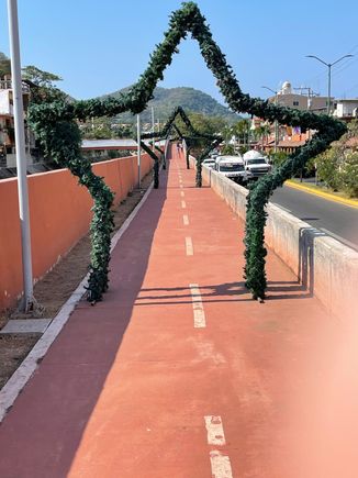 This is a walkway, nicely paved, fairly new and runs along a major road.