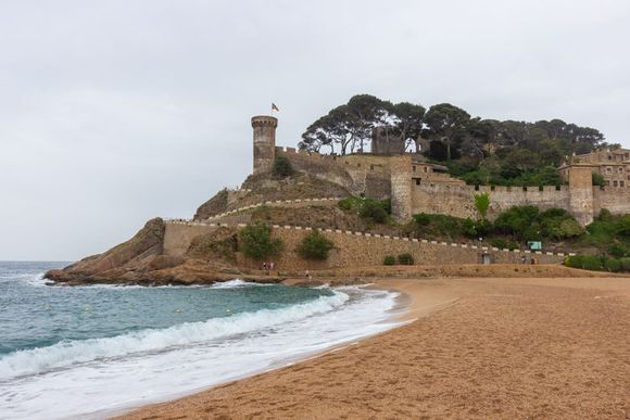 First view of the beach and castle in Tossa de Mar