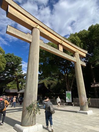 The large Torii gate, one of the two entrances to the Meiji shrine. The torii marks the divide between sacred space and the profane. 
