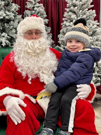 He was a little hesitant at first, but then he hopped right onto his lap. But he is not talking much so he had nothing to say to Santa when asked what he wanted for Christmas. Next year, when he’ll be almost 4, I’m sure that will be a totally different story, lol!