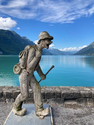 One of the many wooden sculptures along the lakeside in Brienz (look how clear the skies are at that hour)