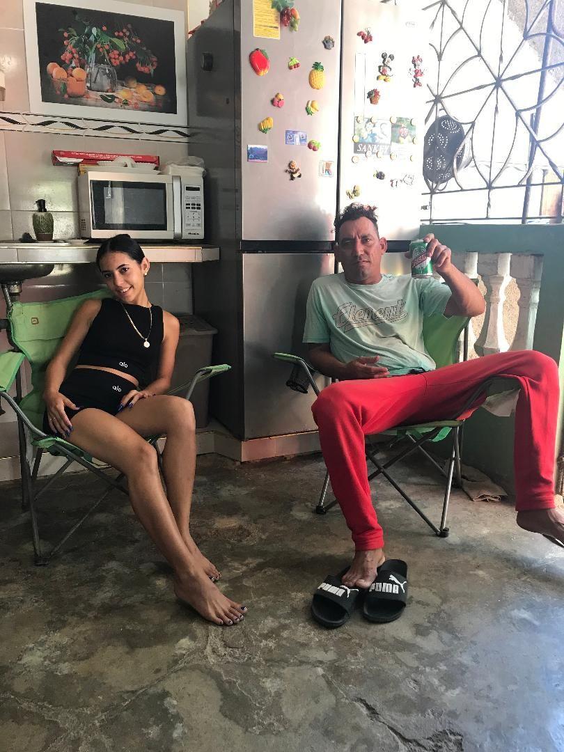 My 17 year old Cuban daughter, Delenys, and my best amigo, Maikel, sitting in our back terrace / kitchen in the morning.