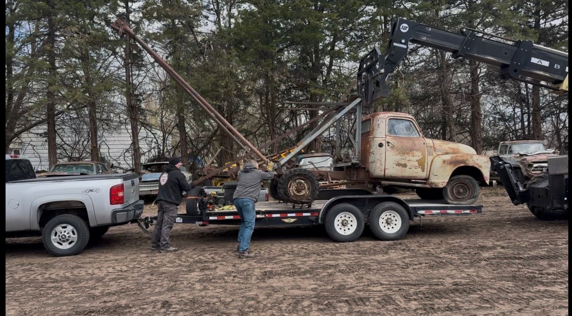 Auction buy #3 but our first haul home.  Sketchy drive home.  My winch wouldn't pull it up with a locked up rear end and the telehandler loaded it backwards.  35mph 45 miles home.