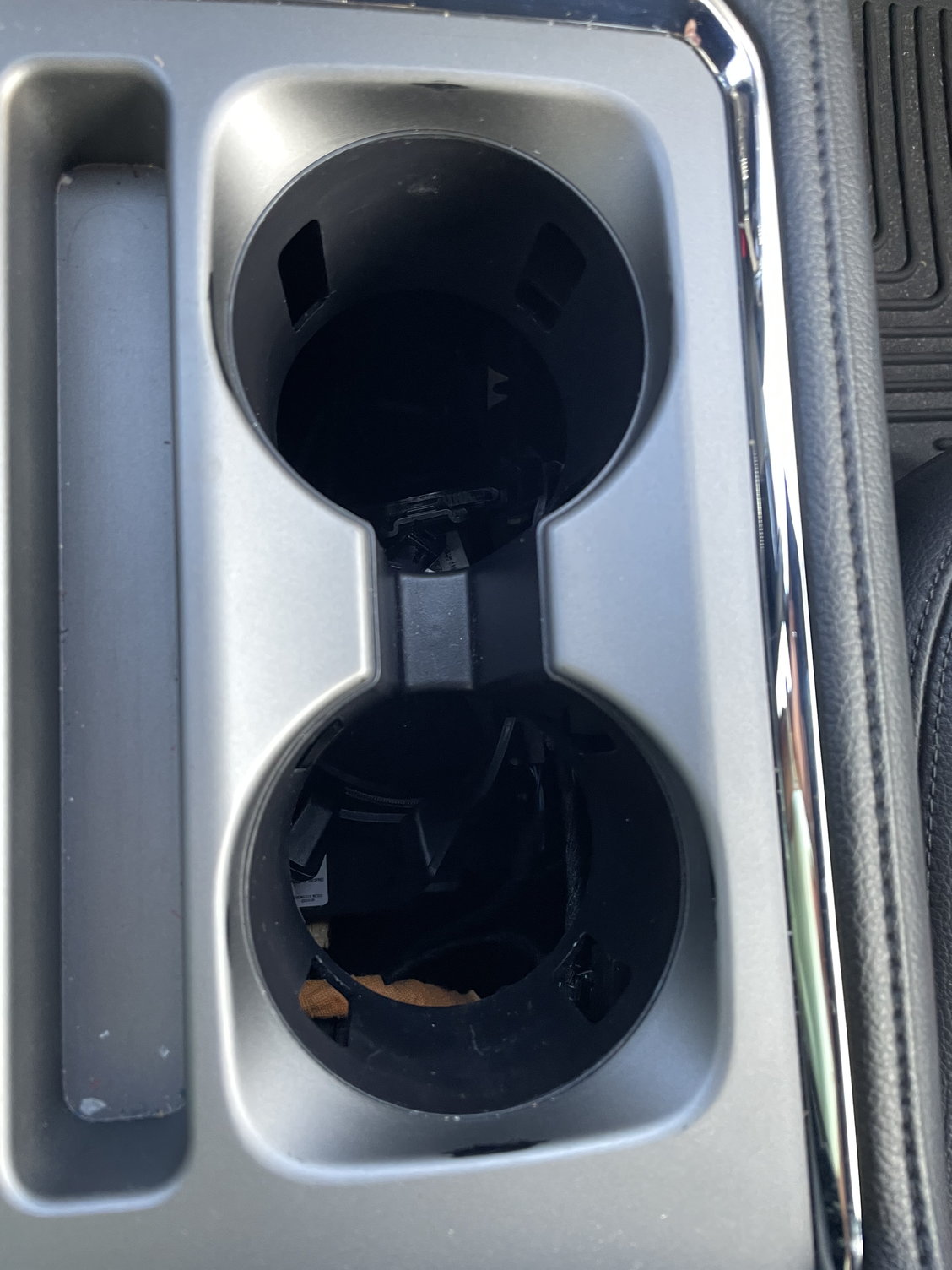 2018 Expedition center cup holder fell into my car Ford Truck